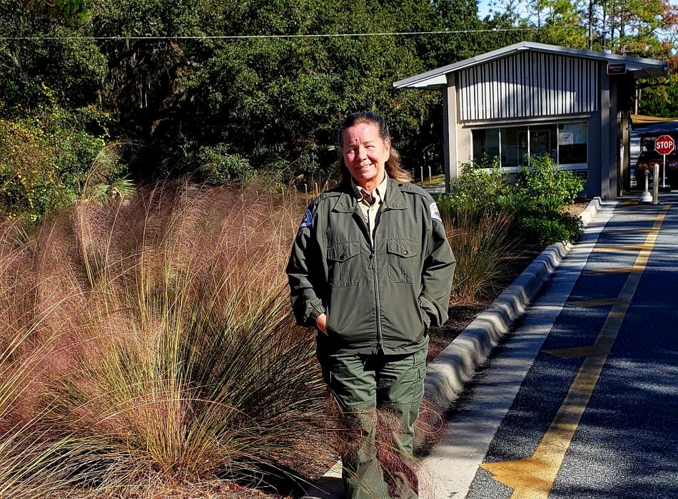 Ranger standing in front of the ranger station