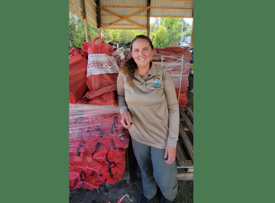 Park Ranger Lauren Sheppard taking inventory of the firewood supply.