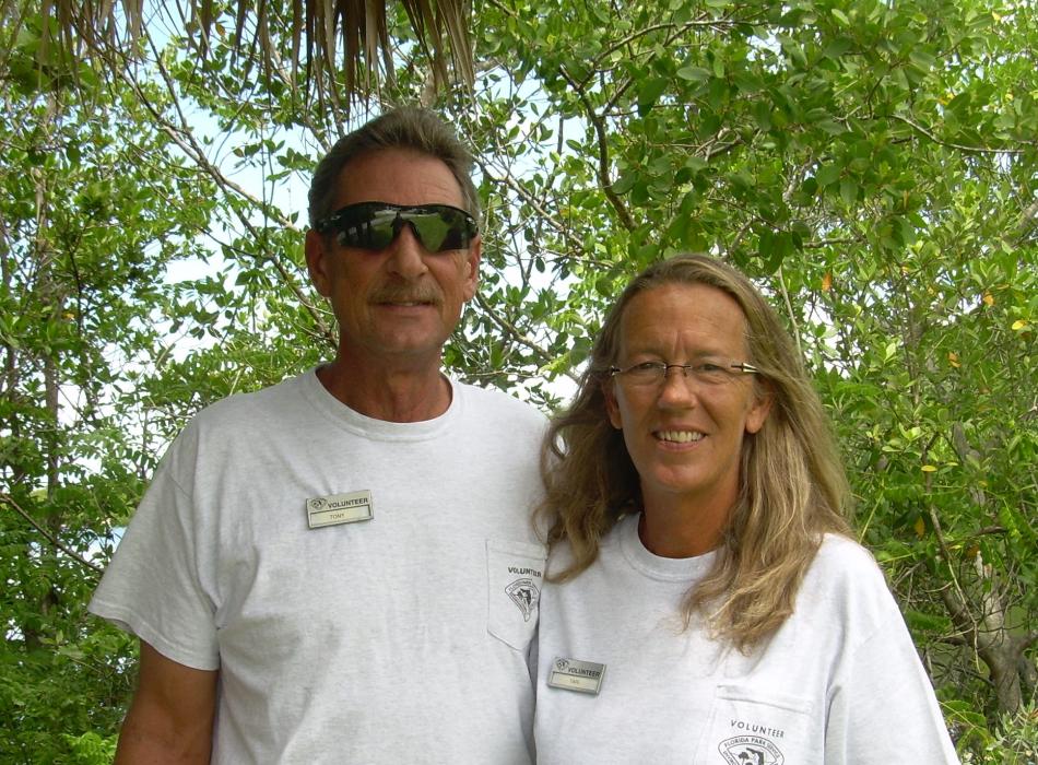 Tony and Tari, standing together, smiling at the camera.