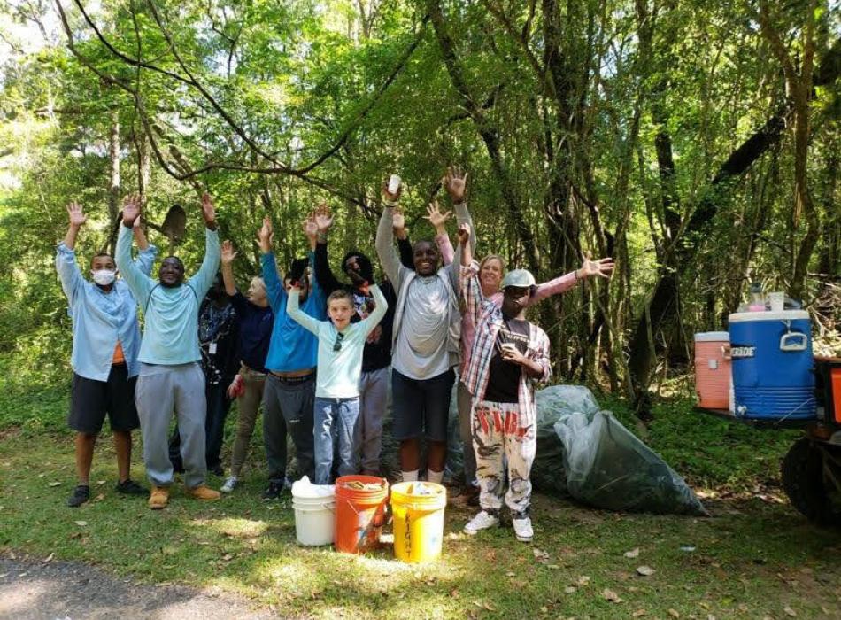 A group of students from ACE School volunteer to remove exotic plants.