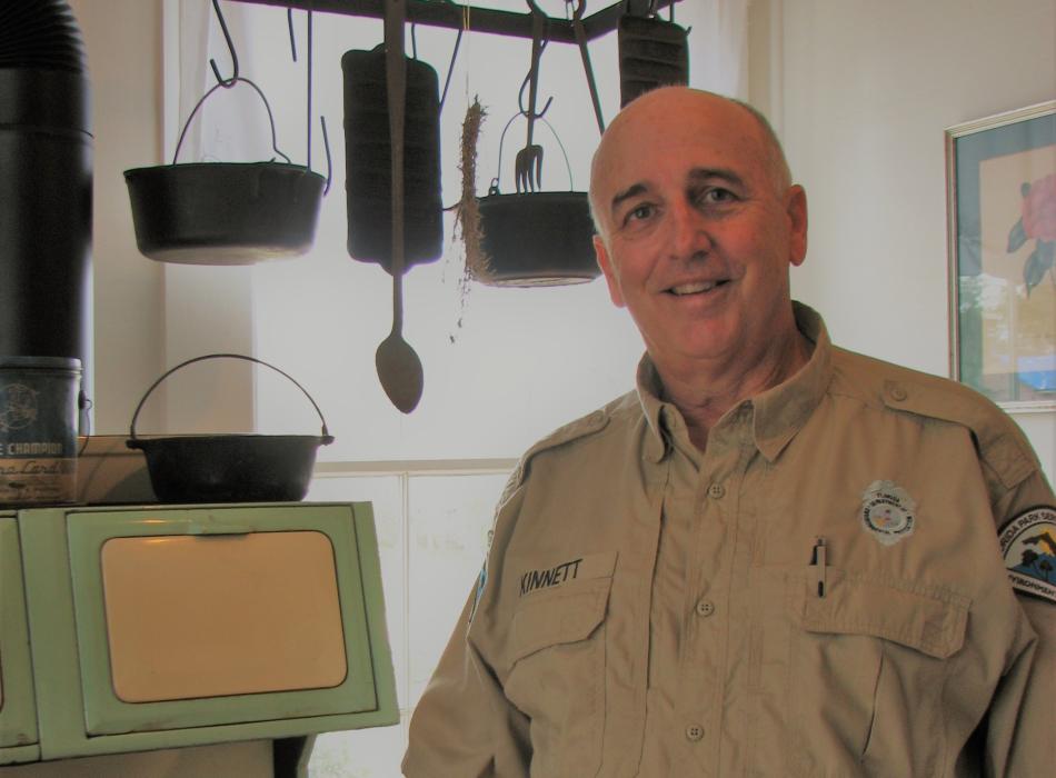 Park Services Specialist Mike Kinnett stands proudly in the Orman House newly renovated kitchen. 