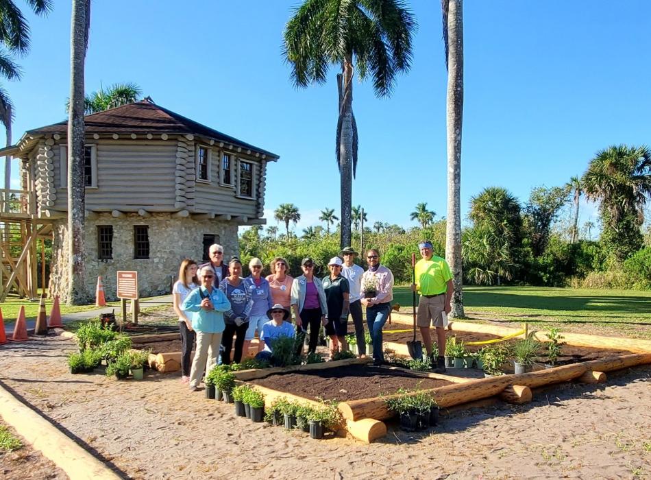 group of people planting a garden