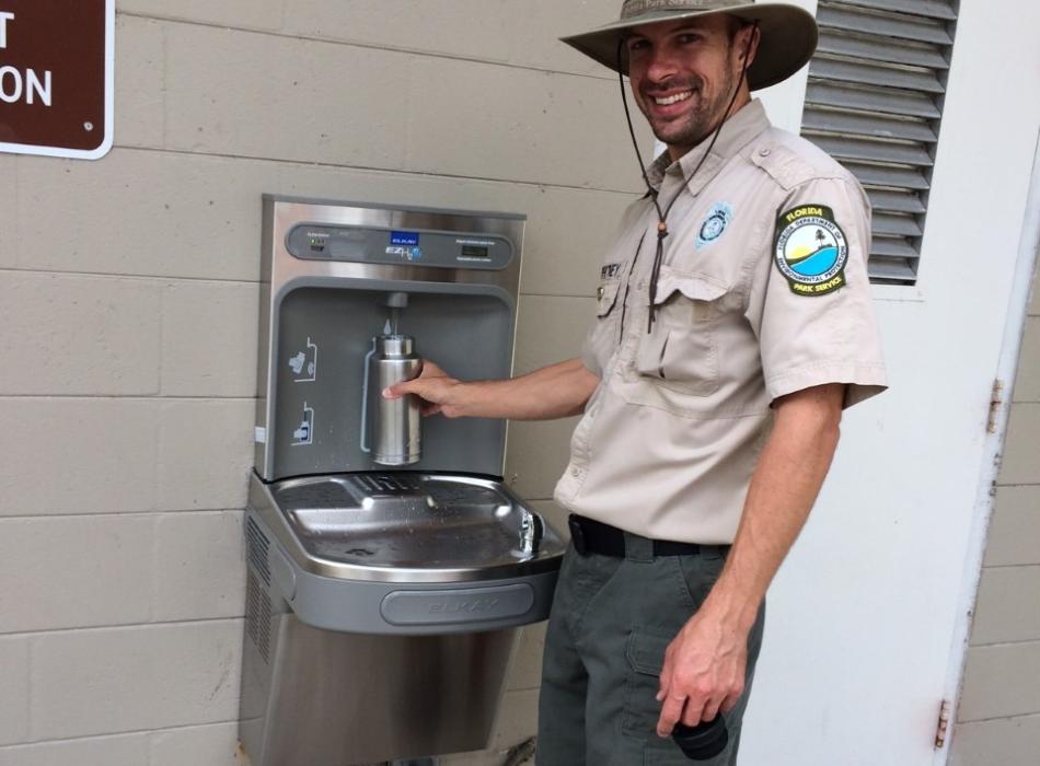 Park ranger using refill station