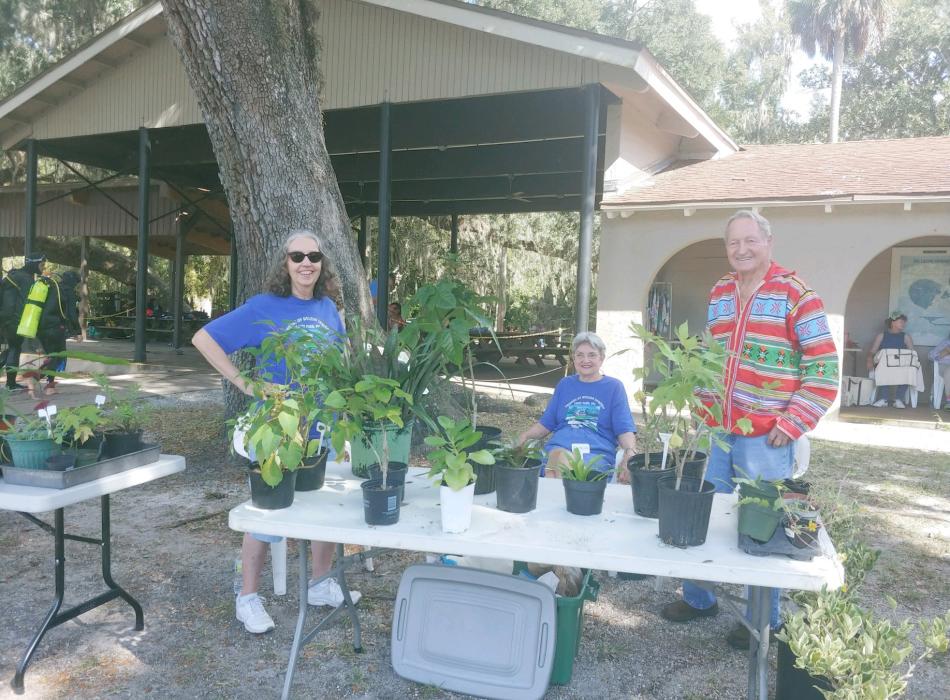 A group of volunteers selling plants from the nursery.