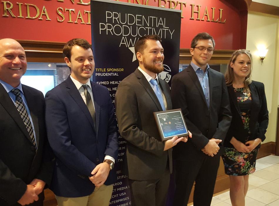 A view of the GIS team posing for a picture with their certificate.