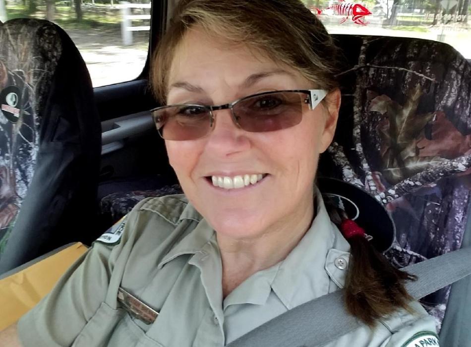 Melody Bamburg sits in a vehicle.