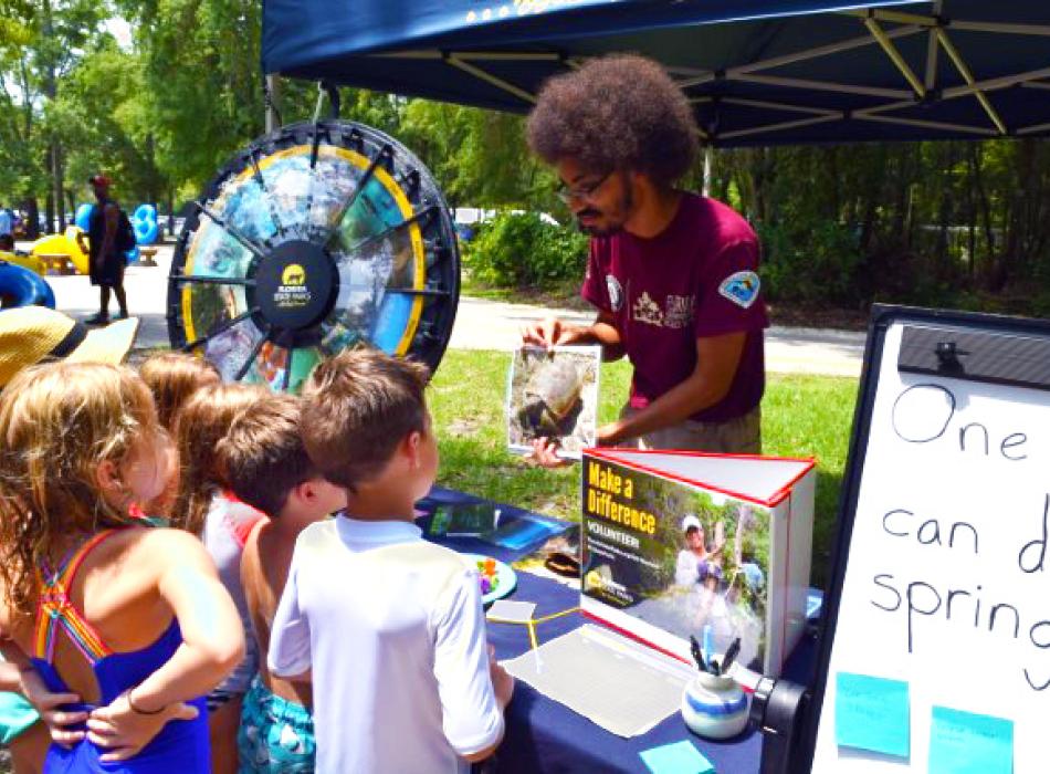 Tyler talking with visitors about protecting freshwater springs.