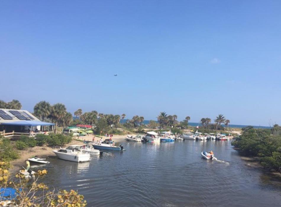 A view of boats lined up along the boat ramp.