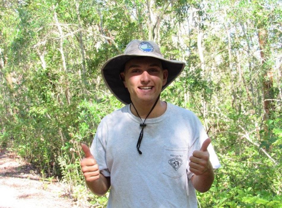 Bradley LeVecchia smiling at the camera, giving two thumbs up.