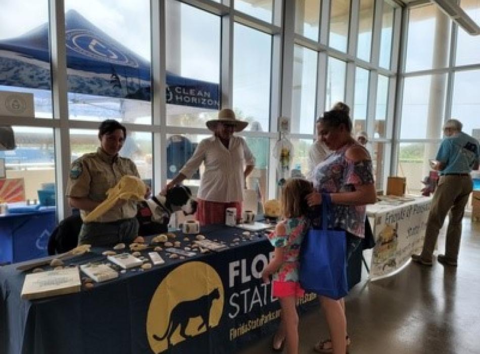 Emily talks to potential volunteers at a local event.