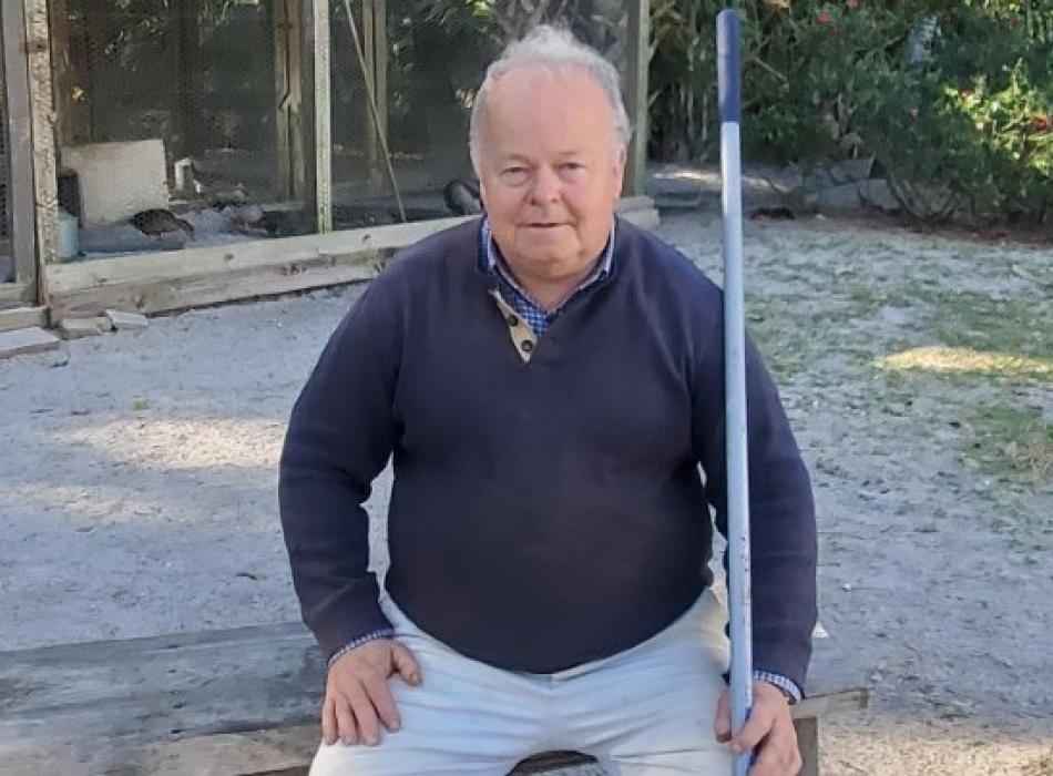 Geoffrey Gates sitting on a swing.