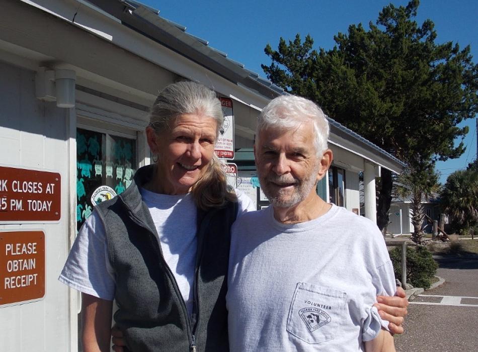 Image of Richard and Joan Becker standing outside a Talbot Island ranger station.